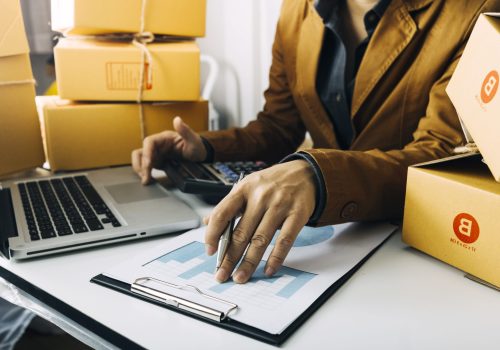 Online sales ideas for work at home. Asian man is answering phone calls. To accept orders from online customers.Very good sale. online Business and E-commerce.Online shop Sell ​​products at home.